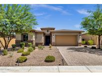Beautiful curb appeal with landscaping and a two-car garage at 32269 N 133Rd Dr, Peoria, AZ 85383