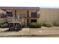 Two-story building exterior with stairs and landscaping at 6501 N 17Th Ave # 209, Phoenix, AZ 85015