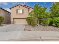 Two-story house with attached garage and landscaping at 33025 N Mildred Ln, San Tan Valley, AZ 85144