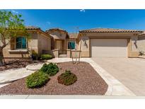 Single-story home with a two-car garage and desert landscaping at 26496 W Lone Cactus Dr, Buckeye, AZ 85396