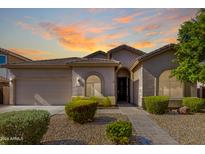 One-story home with a landscaped yard and walkway at 43502 W Kramer Ln, Maricopa, AZ 85138