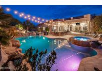 Luxury backyard oasis with a large pool and spa at 5530 W Sand Ct, Queen Creek, AZ 85144