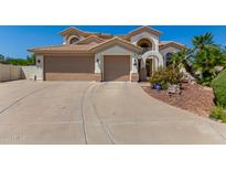 Two-story house with a three-car garage and a curved driveway at 3530 S Velero St, Chandler, AZ 85286