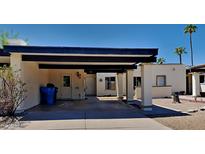 Front view of the property, showing carport and entrance at 3013 W Hearn Rd, Phoenix, AZ 85053