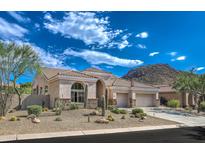 Stunning desert home exterior with landscaping and mountain views at 11377 E Diamond Cholla Dr, Scottsdale, AZ 85255