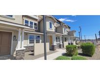 Modern townhome with light-colored siding and stone accents at 639 W Pepper Pl # 102, Mesa, AZ 85201