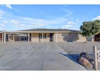 Single story home with carport and front yard landscaping at 5707 N 23Rd Ave, Phoenix, AZ 85015