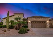 Stunning desert landscape home with a three-car garage at 26747 N 127Th Dr, Peoria, AZ 85383
