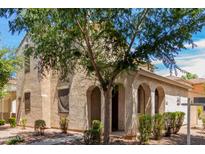 Two-story home with arched entryway and mature trees at 4360 E Carla Vista Dr, Gilbert, AZ 85295