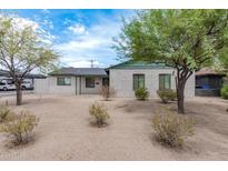 Brick house with green trim and desert landscaping at 1818 W Thomas Rd, Phoenix, AZ 85015