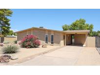 Charming single story home with a well-maintained front yard at 2316 E Betty Elyse Ln, Phoenix, AZ 85022