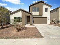Two story house with attached garage and desert landscaping at 2178 N 212Th Ln, Buckeye, AZ 85396