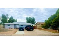 Single story home with a well-maintained front yard at 5919 W Marlette Ave, Glendale, AZ 85301