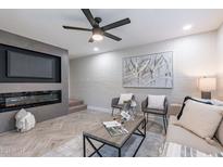 Living room with fireplace, TV niche, and contemporary decor at 1005 N Granite Reef Rd, Scottsdale, AZ 85257