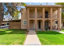 Two-story building with balconies and a grassy yard at 7126 N 19Th Ave # 173, Phoenix, AZ 85021
