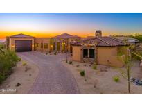 Stunning desert contemporary home with stone accents and a paved driveway at 3518 N Shadow Trl, Mesa, AZ 85207
