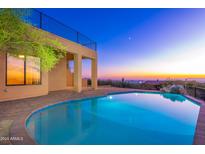 Stunning pool with panoramic sunset views; resort-style backyard oasis at 3518 N Shadow Trl, Mesa, AZ 85207