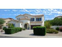 Two-story house with blue shutters, landscaping, and a driveway at 6251 S Moccasin Trl, Gilbert, AZ 85298