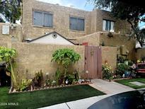 Charming home with a well-maintained front yard at 4255 N 67Th Ln, Phoenix, AZ 85033