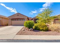 Tan two-story house with attached garage at 9985 E Legend Ct, Gold Canyon, AZ 85118