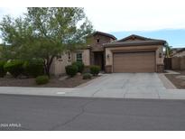 One story home with stone accents and a two car garage at 3026 E Longhorn Dr, Gilbert, AZ 85297