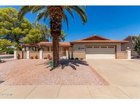 Front exterior view of a charming single-story home with a two-car garage at 930 Leisure World --, Mesa, AZ 85206