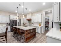 Modern kitchen with island and ample cabinet space at 2419 E Tomahawk Dr, Gilbert, AZ 85298