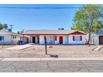 Charming single story home with red accents at 2643 E Clarendon Ave, Phoenix, AZ 85016