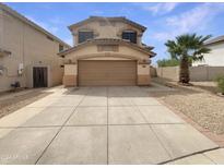 Two-story home with attached garage and a palm tree at 20446 N 37Th Ln, Glendale, AZ 85308