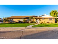 Brick ranch home with artificial turf and mature landscaping at 2112 E Huntington Dr, Tempe, AZ 85282