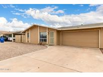 Tan single story home with a two-car garage at 41 E Ivy St, Mesa, AZ 85201