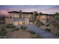 Modern home with stone accents and a three-car garage at 10039 N Mcdowell View Trl, Fountain Hills, AZ 85268