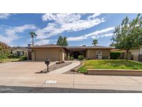 Ranch style home with two car garage and landscaped yard at 5119 W Onyx Ave, Glendale, AZ 85302