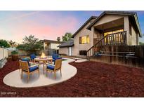 Charming backyard with fire pit and ample space for outdoor enjoyment at 1137 N Gibson St, Gilbert, AZ 85234