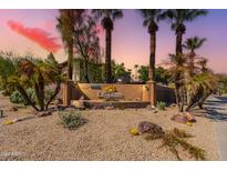 Community entrance with signage and landscaping at 14950 W Mountain View Blvd # 1203, Surprise, AZ 85374