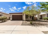 Single-story home with brown garage door and landscaping at 19314 S 208Th Pl, Queen Creek, AZ 85142
