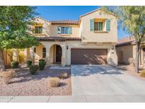 Two-story house with a two-car garage and landscaping at 11040 E Tumbleweed Ave, Mesa, AZ 85212