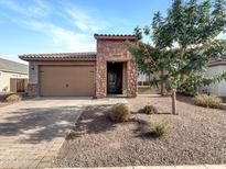 One-story home with stone accents and a two-car garage at 18212 W Illini St, Goodyear, AZ 85338