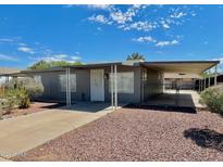 Ranch-style home with carport and landscaping at 831 W Calle Del Norte --, Chandler, AZ 85225