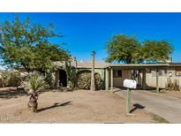 Ranch style home with carport and mature landscaping at 668 W Shannons Way, Coolidge, AZ 85128