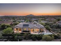 Luxury home with solar panels, a large backyard, and a beautiful mountain view at 36495 N Livorno Way, Scottsdale, AZ 85262