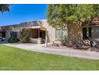 Front view of charming single story home with covered patio at 14300 W Bell Rd # 93, Surprise, AZ 85374