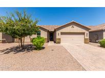 Charming one-story home with a beige stucco exterior and brick driveway at 1966 W Larissa Ln, San Tan Valley, AZ 85144