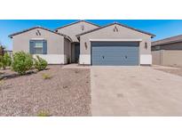 Modern two-story home with gray garage door and landscaping at 3454 E Jasmine Way, San Tan Valley, AZ 85143
