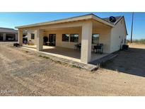 Covered patio, grassy lawn, and a spacious backyard at 1527 E Germann Rd, San Tan Valley, AZ 85140