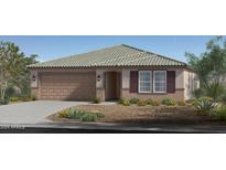 Single-story home with a tile roof, two-car garage, and landscaped yard at 18192 W Pima St, Goodyear, AZ 85338