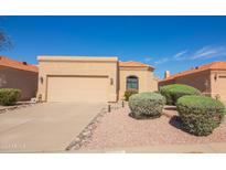 Single-story home with attached garage and desert landscaping at 12122 N Finch Dr, Fountain Hills, AZ 85268