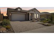 Craftsman style home with a two-car garage and landscaped front yard at 13190 W Horsetail Trl, Peoria, AZ 85383