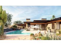 Luxury home with inviting pool, expansive patio, and desert landscape at 40575 N 109Th Pl, Scottsdale, AZ 85262