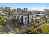 Aerial view of a modern building in a city setting with many surrounding buildings at 1130 N 2Nd St # 409, Phoenix, AZ 85004